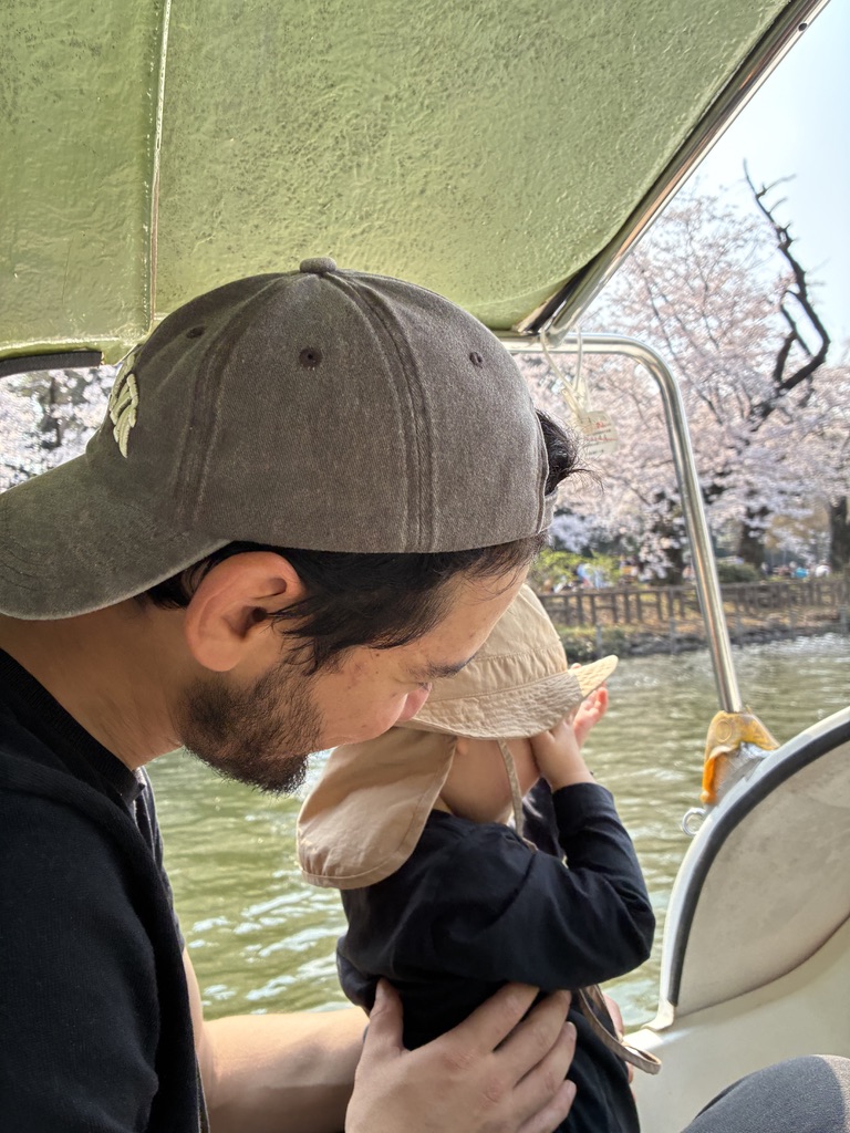 Tahir with his child under cherry blossoms in Tokyo